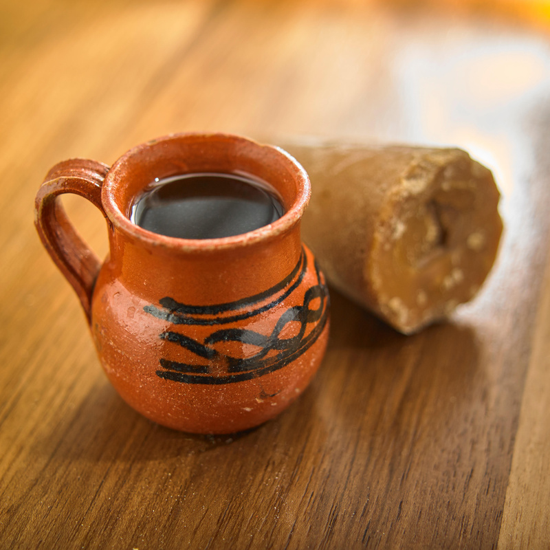 coffee pot with piloncillo on wood